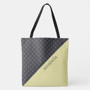 Bolsa de mão com padrão de caveiras monogramada