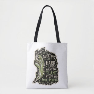 Bolsa de mão em bordado verde com estética botânic