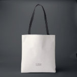 Bolsa de mão minimalista com monograma para damas<br><div class="desc">Um presente que elas levarão para todos os lugares - literalmente. Esta bolsa de mão marfim com um monograma cinza discreto é espaçosa o suficiente para os itens essenciais do dia do casamento e elegante o suficiente para tarefas cotidianas. Um presente personalizado para damas de honra que é tão prático...</div>