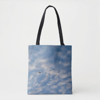 Bolsa Tote Airplane Crossing a Cloud-Filled Blue Sky