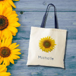 Bolsa Tote Amarelo Botânico de Girassol Moderno<br><div class="desc">Saco botânico de girassol moderno com cores amarelas brilhantes. Com a inscrição azul,  você pode personalizar com seu próprio texto. Aproveite este item acessório de na moda que é excelente para quando você estiver em movimento.</div>