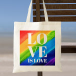 Bolsa Tote Amor é Orgulho de Amor<br><div class="desc">Este Saco do Orgulho é decorado com LOVE IS LOVE em letras brancas em negrito sobre um fundo arco-íris de cor d'água de vermelho,  laranja,  amarelo,  verde,  azul e roxo. Original Watercolor © Michele Davies.</div>