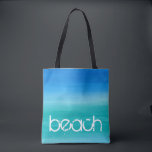 Bolsa Tote Beach Watercolor Ocean Blue Green<br><div class="desc">Esta design de praia apresenta texto angustiado em uma cor d'água, azul e verde do oceano. Clique no botão personalizar para opções de modificação ou adição de texto! Variações deste design, cores adicionais, além de coordenar produtos estão disponíveis em nosso compro, zazzle.com/store/doodlelulu. Entre em contato conosco se precisar deste design...</div>