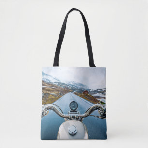 Bolsa Tote Biker rides a motorcycle on a slippery road throug