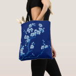 Bolsa Tote Blue Cherry Blossom Aesthetic<br><div class="desc">Infuse your everyday style with the serenity of this blue cherry blossom tote bag. Featuring a stunning, hand-painted style illustration of sakura branches, the delicate white and light blue blooms glow against a deep navy background. This elegant design captures the essence of traditional Japanese art with a modern, monochromatic twist....</div>