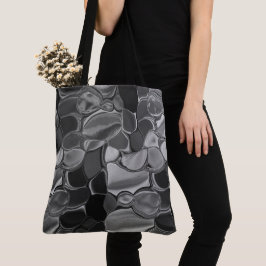 Bolsa Tote Cinzas claras e formas arredondadas escuras.