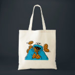 Bolsa Tote Cookie Monster Eating All the Cookies<br><div class="desc">Satisfy your cravings for fun and cookies with this graphic featuring the one and only Cookie Monster! This showcases a vibrant illustration of Cookie Monster in his element, happily devouring a pile of chocolate chip cookies with crumbs flying everywhere. This classic and instantly recognizable design is cheerful, playful, and sure...</div>