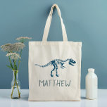 Bolsa Tote Crianças Engraçadas, T-Rex Dinossauro Fóssil Schoo<br><div class="desc">Esta fofa design de tote de crianças personalizadas apresenta um dinossauro azul t- Rex. Também há espaço para você adicionar seu nome de garotos, na tipografia moderna. O presente temático perfeito para dinossauros para qualquer entusiasta da história ou dinossauro, excelente para um kit esportivo ou bolsa de escola para crianças...</div>
