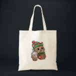 Bolsa Tote Cute Christmas Cat Tote Bag<br><div class="desc">This cute kawaii Christmas cat tote bag features an adorable festive kitty wearing a winter hat and holding a holiday gift and iced coffee. The playful illustration makes this bag perfect for cat lovers,  coffee fans,  and anyone who enjoys cozy winter aesthetics.</div>