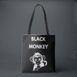 Bolsa Tote Cute Little Black Monkey<br><div class="desc">Meet your new favorite jungle friend! This adorable peeking monkey design features a clean,  white illustration that pops perfectly on dark fabrics. A fun and playful choice for kids,  wildlife enthusiasts,  or anyone who loves a bit of monkey business.</div>