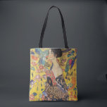 Bolsa Tote Gustav Klimt Lady Com Pintura Fan Art Nouveau<br><div class="desc">Gustav Klimt Lady With Fan Art Nouveau Painting Este meio retrato de uma bela mulher mostra um fundo amarelo com ornamentos asiáticos, pássaros coloridos e flores de lótus. A senhora veste um vestido no estilo de um quimono impresso com motivos de um vestido de dragão chinês. Linda pintura artística romântica...</div>
