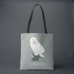 Bolsa Tote Hedwig With Letter Whimsical Drawing<br><div class="desc">Deliver a little magic with this charming Hedwig illustration inspired by the wizarding world. Perched atop a stack of spellbinding textbooks labeled Potions and Herbology, Hedwig proudly holds a sealed Hogwarts™ letter. The soft, minimalist style and muted tones give this design a cozy, storybook feel, while subtle sparkling accents add...</div>