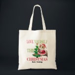 Bolsa Tote  Love Yourself This Christmas Cute Cat Holiday<br><div class="desc">Spread a message of self-love this holiday season with this charming Christmas cat. Featuring a festive kitty in a Santa outfit perched by a decorated tree, this design serves as a gentle reminder to prioritize your own well-being during the holidays. A sweet and meaningful choice for cat lovers and anyone...</div>