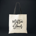 Bolsa Tote Matrão Negra de Honra Tote Bag<br><div class="desc">Saco de tota moderno e clássico,  com o script de inscrição manual MATRON OF HONOR,  preto. Personalize adicionando o nome do receptor ou a hashtag do casamento. Perfeito como presente para sua festa de casamento ou festa noiva.</div>