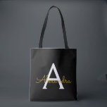 Bolsa Tote Monograma de Script Raiz Dourado de Nome Negro Mod<br><div class="desc">Preto e Dourado Elegante Adicione seu próprio nome Monograma Book Bag. Este Livro Bag pode ser personalizado para incluir seu nome inicial e próprio e ser dado como presente para o Natal,  Doce 16 Aniversário,  Chá de panela ou Casamento.</div>