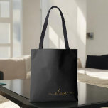 Bolsa Tote Monograma de Script Raiz Dourado de Nome Negro Mod<br><div class="desc">Preto e Dourado Elegante Adicione seu próprio nome Monograma Book Bag. Este Livro Bag pode ser personalizado para incluir seu nome inicial e próprio e ser dado como presente para o Natal,  Doce 16 Aniversário,  Chá de panela ou Casamento.</div>