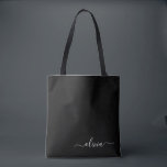 Bolsa Tote Monograma Elegante Moderno e Branco Negro<br><div class="desc">Apresentando nossa Coleção de Monogramas Modernos Minimalistas Pretos e Brancos: adote simplicidade e sofisticação com nossos designs minimalistas, curados para elevar seu estilo sem esforço. Feita de olho na estética moderna, essa coleção apresenta designs negras e brancos elegantes, acentuados por monogramas personalizados. De papelaria chic a acessórios versáteis, nossa coleção...</div>