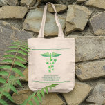Bolsa Tote Naturopath do centro de bem-estar dos medicamentos<br><div class="desc">Este médico holístico e personalizado, tote saco para uma grande abertura de centro de bem-estar, apresenta um belo caduceus médico verde envolto em folhas botânicas para combinar natureza e bem-estar em um logotipo moderno para uma naturocaminho. Um curandeiro natural ou apoteórico vai adorar o aspecto natural desta design. Estas são...</div>
