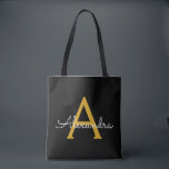 Bolsa Tote Nome Ouro Preto Script Monograma Moderno Feminino<br><div class="desc">Preto e Dourado Elegante Adicione Seu Nome Monograma Bolsa de Livros. Esta bolsa de livros pode ser personalizada para incluir seu inicial e primeiro nome e dada como presente de Natal,  Aniversário de 16 anos,  Chá de Noiva ou Casamento.</div>