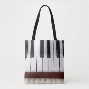 Bolsa Tote notas musicais sobre o fundo de uma pianoacústica