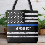 Bolsa Tote Oficial de Polícia Personalizado Linha Azul Fino P<br><div class="desc">Apresentando nossa nova bandeira azul fina Tote Bag, perfeita para policiais, mães policiais, esposas policiais, policiais e qualquer um que queira mostrar seu apoio à polícia. Projetada em um estilo vintage angustiado, esta bolsa de tote mostra a bandeira americana com uma linha azul fina que representa a coragem e o...</div>