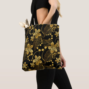 Bolsa Tote Padrão de folhas e flores tropicais preto e dourad