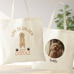 Bolsa Tote Personalized Golden Doodle Life is Golden Photo<br><div class="desc">Celebrate the joy of your furry friend with this charming Personalized Golden Doodle tote bag. The front features a sweet, apricot-colored hand-drawn illustration paired with the uplifting message, "Life is Golden with my Doodle." On the back, you can easily upload your favorite pet photo and add their name for a...</div>