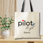 Bolsa Tote Pilot Wife Script Heart Airplane Simple Custom<br><div class="desc">The word "Pilot" is designed with a cute tiny red heart image above the letter "i" and a fun blue airplane at the end of word "Pilot". The word 'Wife' is in a script calligraphy font right below the word Pilot. Personalize your name in this simple, minimalist design for a...</div>