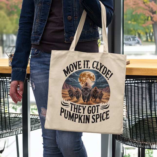 Bolsa Tote Pumpkin Spice Coffee Funny Bison Stampede (woman in a coffee shop holding funny pumpkin spice humor tote bag)