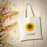 Bolsa Tote Rústica Floral Moderna do Girassol<br><div class="desc">Saco floral moderno,  com uma imagem florescente de girassol amarelo rústico. Com a inscrição de script preto,  você pode personalizar o texto para fazer um acessório personalizado do excelente. Perfeito para manter seus itens juntos quando você estiver em movimento.</div>
