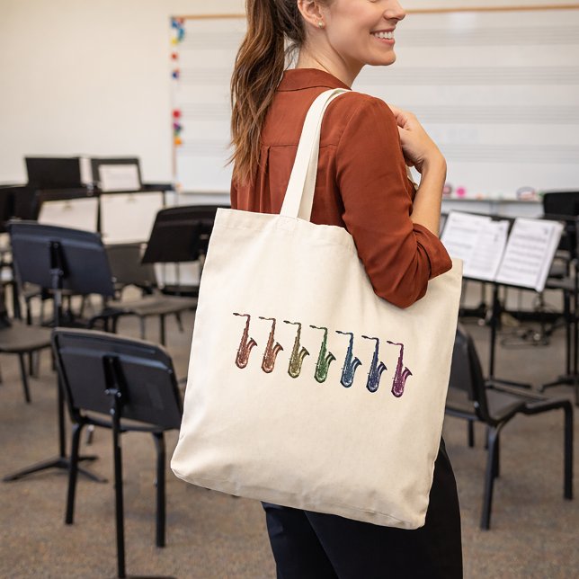 Bolsa Tote Saxofones Tenor Arco-íris (A tote bag with a fun rainbow saxophone design.)