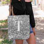 Bolsa Tote Silver Faux Glitter Bokeh Sparkles Monograma<br><div class="desc">Um moderno monograma solteiro em branco com uma sombra negra. O tamanho, a cor e o estilo da fonte são personalizáveis. O fundo é uma falsa cinza prateada reluzente com manchas cintilantes ou bokeh. Mova ou elimine as minúsculas imagens de cinza. Presente de cinza para uma dama de honra ou...</div>