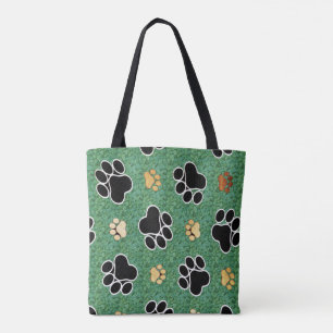 Bolsa Tote Tan e a pata preta imprimem na grama verde