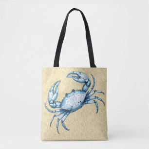 Bolsa Tote Um caranguejo azul em um fundo arenoso