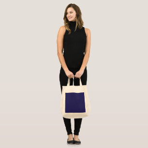 Bolsa Tote um fundo azul com um relógio nele