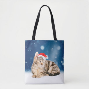 Bolsa Tote Um gato bonito vestindo o Papai Noel vermelho e a 
