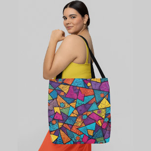 Bolsa Tote Um padrão abstrato colorido composto por geometria