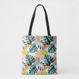 Bolsa Tote Um padrão tropical perfeito. Folhas verdes de uma