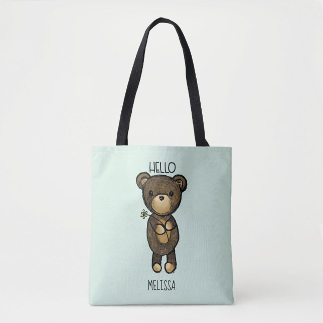 Bolsa Tote Urso castanho-branco segurando uma flor amarela (Frente)