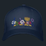 Boné Bordado Chanukah Letters<br><div class="desc">Hanukkah design apresenta texto feito de dridel,  Menorah,  Estrela de David e moedas de ouro.</div>