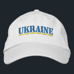 Boné Estilo de letra azul UKRAINE e estilo amarelo<br><div class="desc">UCRÂNIA Cores Azul e Amarelo Estilo de Estêncil Fonte bordada no Chapéu Branco para mostrar seu apoio à Ucrânia!</div>