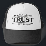 Boné It's All About Trust<br><div class="desc">“It’s All About Trust.”

Simple words. Enduring principle.

Trust is the foundation behind everything that lasts—relationships,  leadership,  and the commitments we make every day. This hat keeps the message clear and visible: trust isn’t declared,  it’s demonstrated.

Clean design.
Timeless reminder.
Worn with intention.</div>