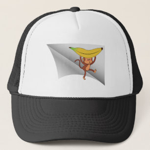 Boné macaco com banana debaixo do adesivo