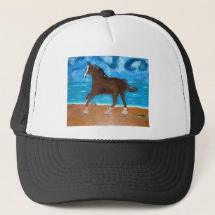Boné um cavalo na praia