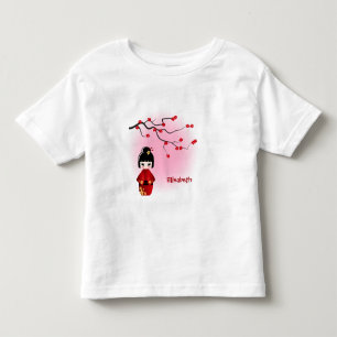 Boneca kokeshi japonesa na camisa da moça sakura