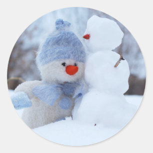 Boneco de neve adorável com etiqueta azul do Nata