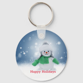 Boneco de neve com um cachecol verde chaveiro