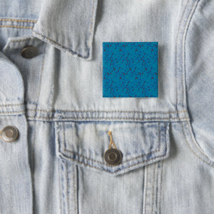Bóton Quadrado 5.08cm um fundo azul e preto com um padrão
