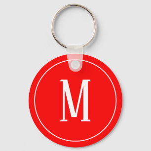 Branco do monograma no chaveiro vermelho