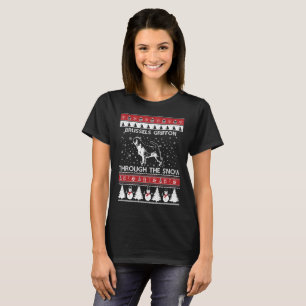 Bruxelas Griffon através do t-shirt da neve